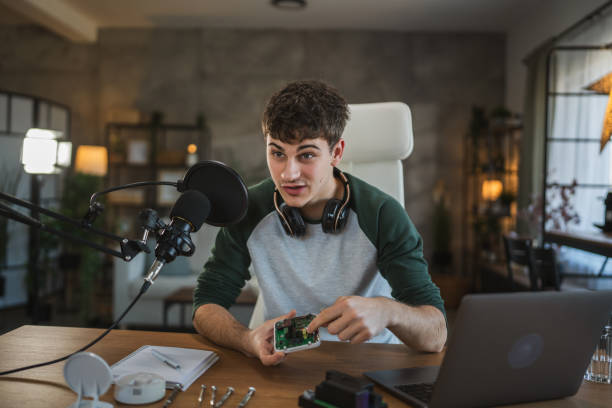 istock Young adult man record technology podcast in home studio setup 2185158257