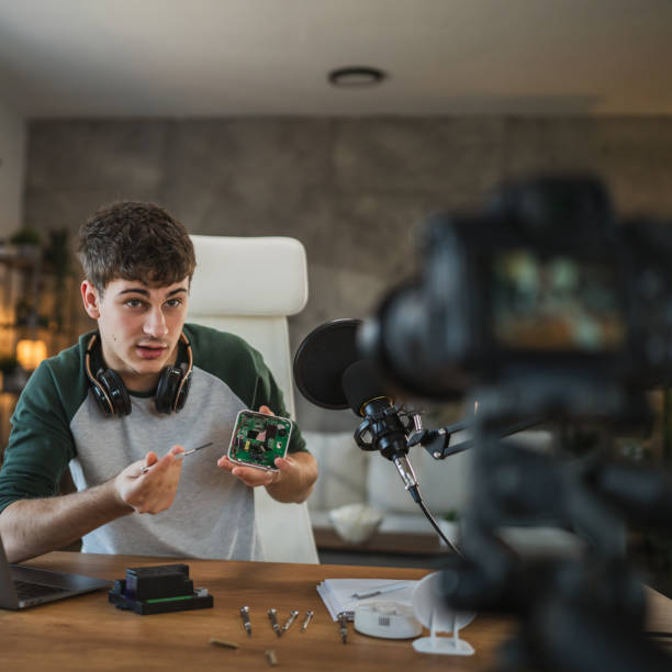 istock Young adult man record technology podcast in home studio setup 2185158400
