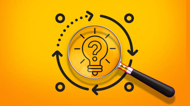 istock Magnifying glass with a lightbulb icon and question mark, circular arrows, bright yellow background, innovation and problem-solving concept, minimalist design, orange glow effect, clean lines, vector style. 3D render. 2185158542