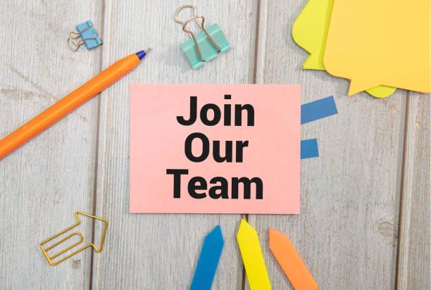 istock Join our team symbol. Wooden blocks with words Join our team. 2185160545