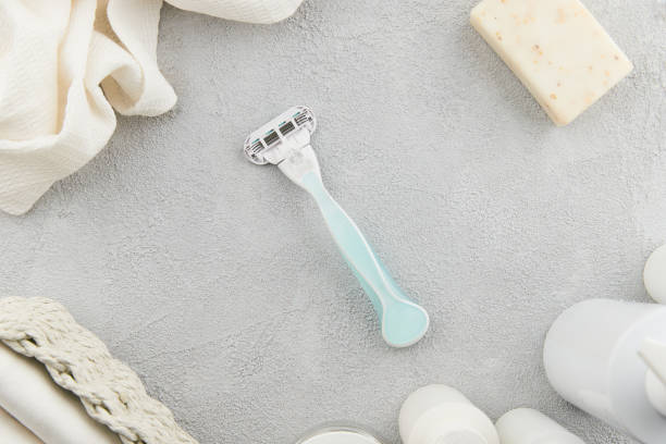 istock High-quality razor showcased on a sophisticated gray backdrop. Grooming routine with style and precision 2185161921