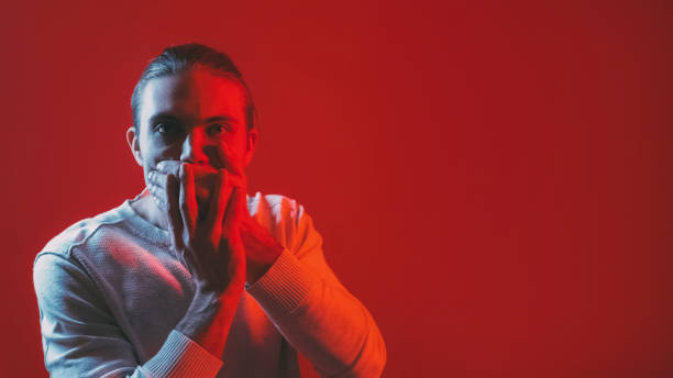 istock Talk no fear expression man covering hand mouth 2185162665