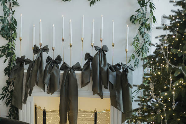 istock Elegant holiday decor featuring candles and greenery on a mantel 2185162715