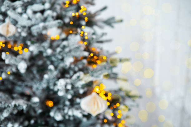 istock A beautifully decorated Christmas tree with warm lights in a cozy interior 2185162758