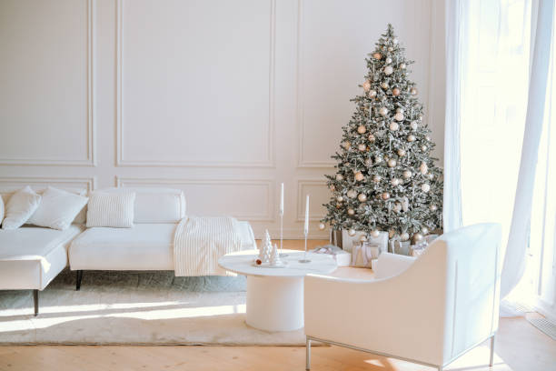 istock Cozy modern living room with decorated Christmas tree in natural light 2185162913