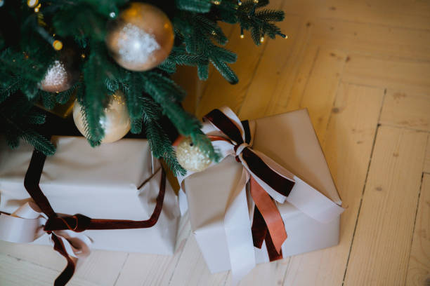 istock Christmas presents under a beautifully decorated tree with elegant ornaments 2185163032