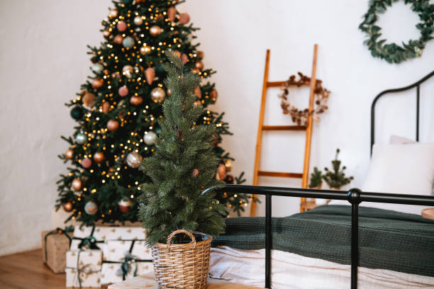 istock Cozy winter bedroom with Christmas tree and festive decorations 2185163152
