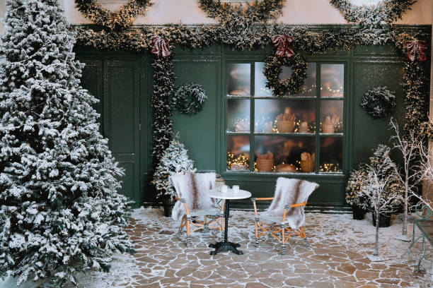 istock Cozy winter seating area adorned with holiday decorations and snow 2185171743