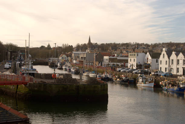 Eyemouth harbour fishing boat and town Berwickshire on Novemberl day