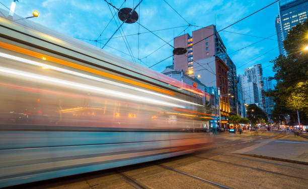 Beautiful view of blur motion city bus at the busy road of Sydney, downtown cityscape at dusk.