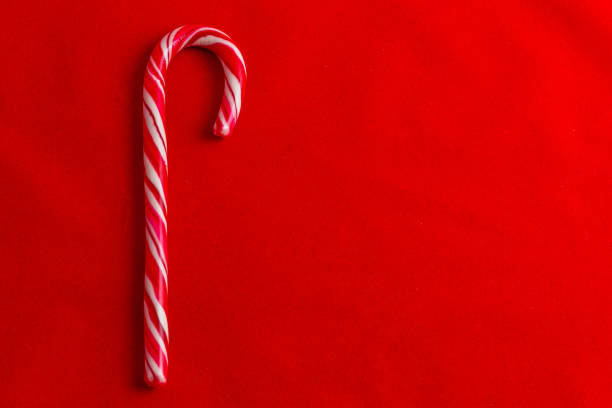 istock Red and white cane lollipop on red background, Christmas concept 2185181371