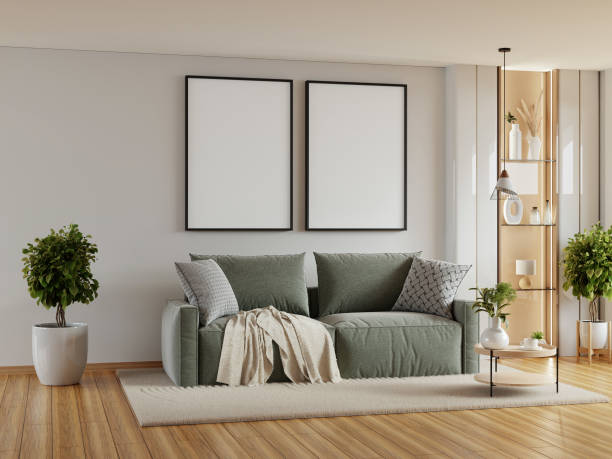 istock Living room with a green couch and two empty picture frames on the wall- 3D rendering 2185182428