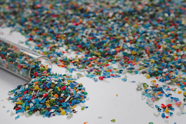istock Hands hold clear white plastic pellets, raw materials for various manufacturing processes. These pellets are widely used in industries to produce products like packaging, bottles, and equipment parts. The white background highlights the pellets, making th 2185182484