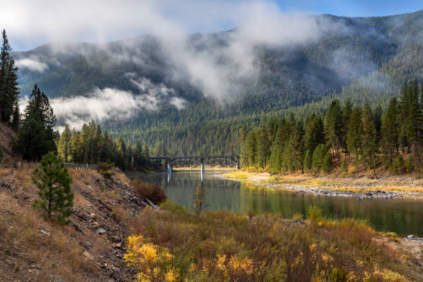 Bridge over the Clark Fork River in cool and autumn morning, Montana, USA