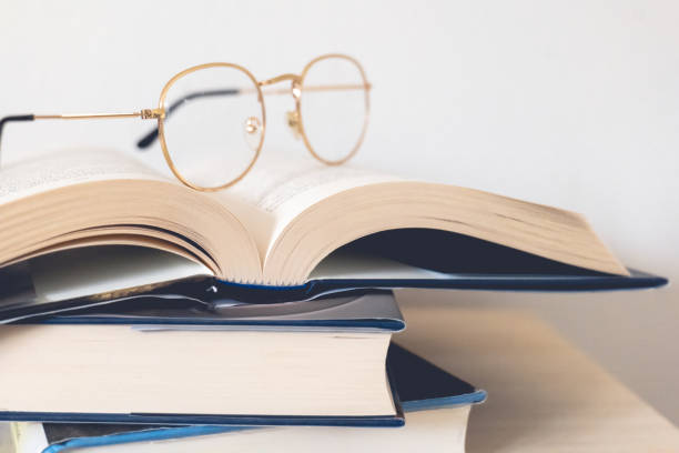 istock eyeglasses on top of books 2185189474