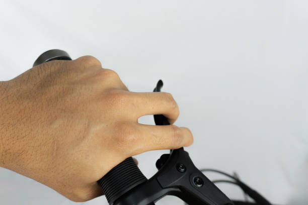 istock a man hand gripping the handlebars of a black bicycle 2185189506