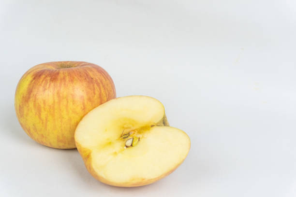 Wet apple in abstract lighting.
