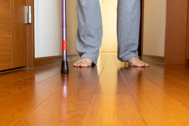 istock A person walking down a corridor with a cane 2185195099
