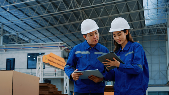 2 Worker Task Professional Workers In A Modern Factory Discussing Operations And ...