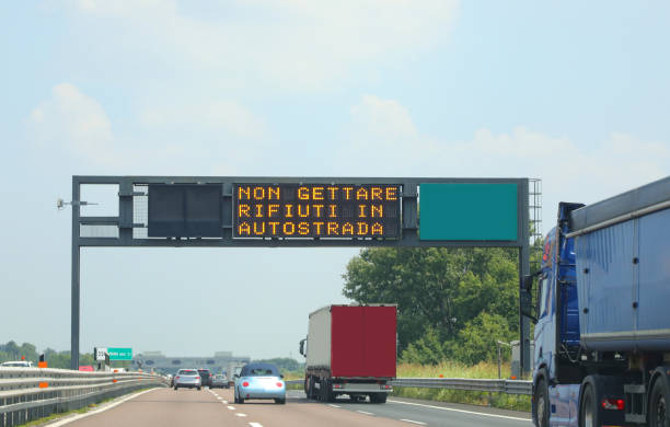 istock big gate with message do not throw trash on the highway trucks are speeding 2185196142