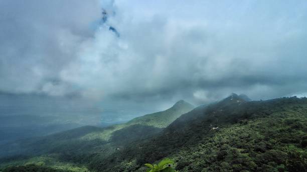istock A beautiful landscape with green mountain and cotton cloud. Parasnath Hill situated at Jharkhand in India 2185196285