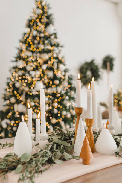 istock Burning candles against the backdrop of a large New Year tree 2185198805
