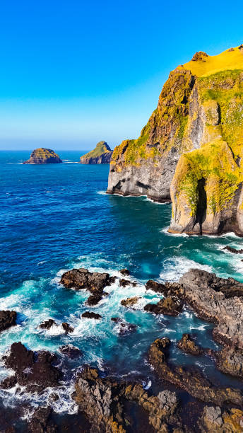 istock Coastal cliffs and ocean view in Europe. Dramatic cliffs meet a turquoise sea in this stunning European coastal landscape. 2185199891