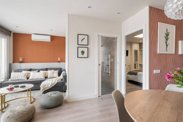 istock Modern living room with lounge area with dining round table and decorative accessories in a modern urban residential complex with open bedroom and bathroom in european country 2185200369