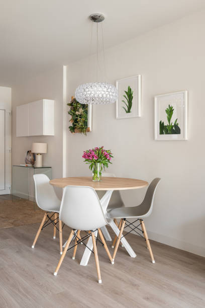 istock Modern stylish living room with a round dining table, console and decorative accessories on the walls. Hotel concept in a hotel with a five-star service 2185200418