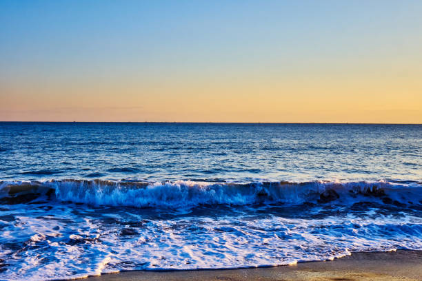 istock Scenic view of beach against moody clear sky during sunset 2185200506