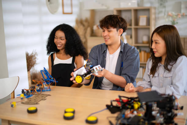 istock University students are brainstorming for build robot. 2185202380