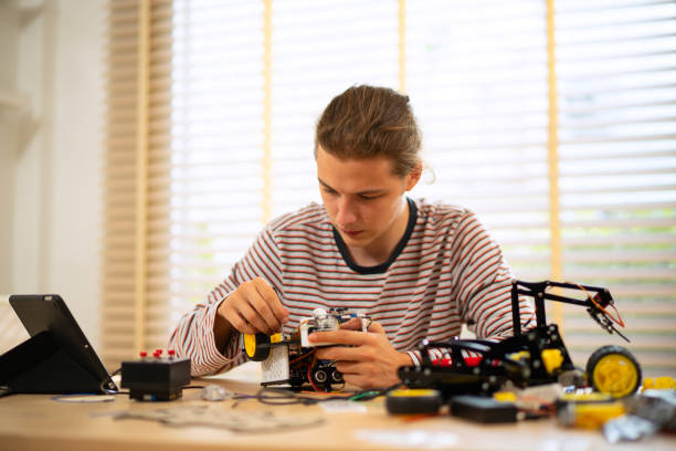 istock University student is brainstorming for build robot. 2185202436