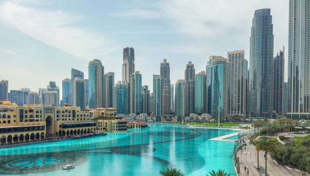 istock Architectural ensemble of Downtown Dubai with a blue pool in the foreground, reflecting the atmosphere of a modern metropolis 2185202868