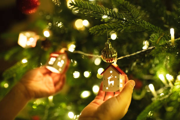 istock Close-up of a little boy's hands decorating Christmas tree 2185204373