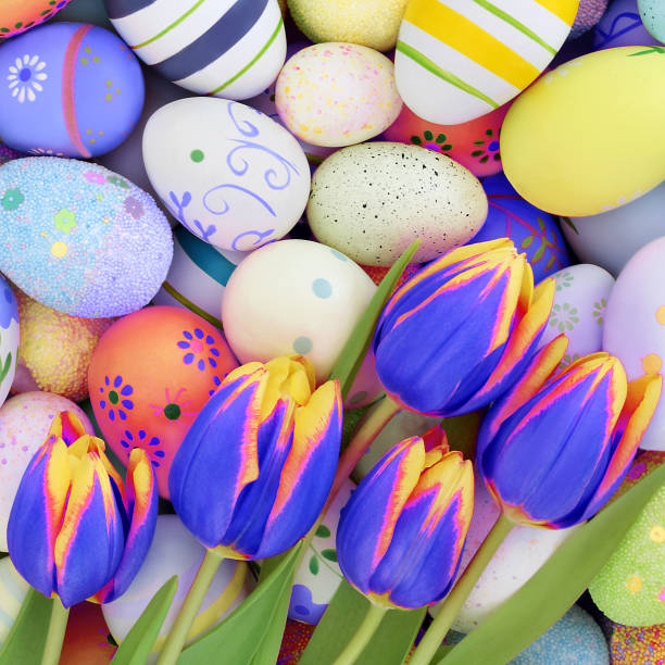 istock Easter Eggs and Vivid Spring Tulip Flowers 2185205760