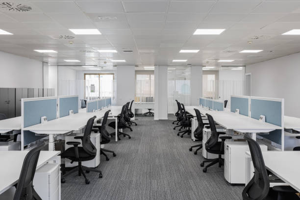 istock Spacious empty office in gray colors with comfortable office furniture without equipment with private areas for comfortable work of employees. Concept of a modern corporate space in a coworking center 2185207668