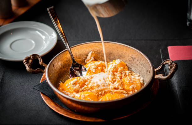 istock Delicious Mango Dessert with Cream Served in Elegant Metal Bowl 2185208784