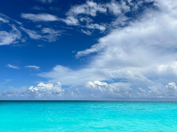 Caribbean tropical turquoise sea with dramatic perfect clouds, a perfect vacation destination in Mayan riviera