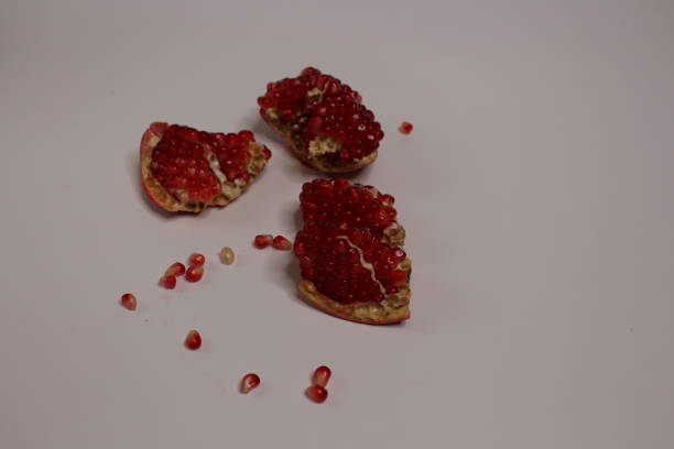 Sweet red pomegranate isolated on white background. High quality photo