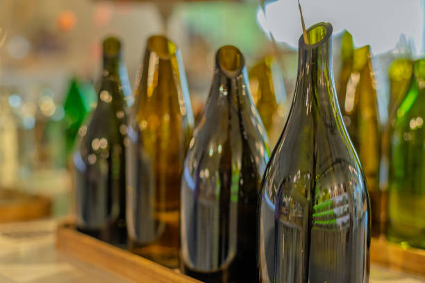 istock A row of wine bottles are lined up on a table 2185213891
