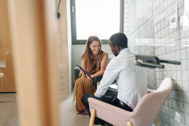 istock Professional Teamwork Between Diverse Business Colleagues in Office 2185214236