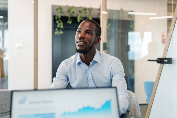istock Professional Black Businessman in Boardroom Meeting 2185214270