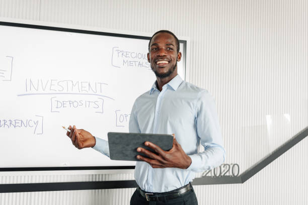 istock Confident Black Businessman Leading Office Presentation 2185214282