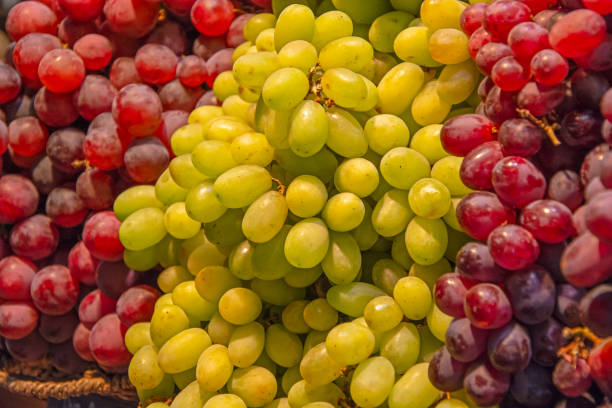 istock bunch of white grapes and red grapes 2185215026