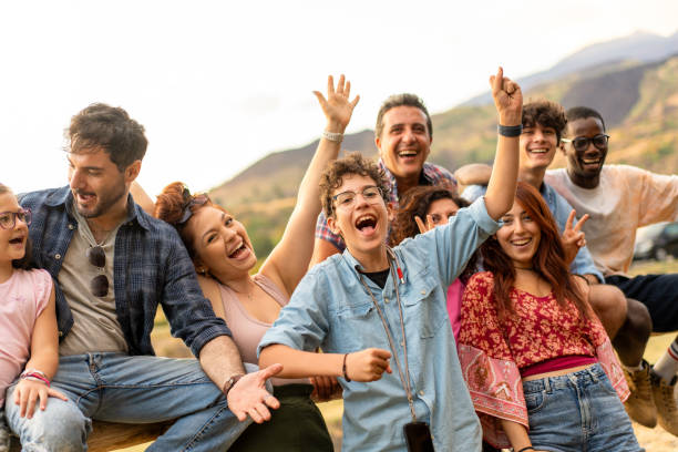 istock Diverse group celebrating outdoors friendship and joy with mountains backdrop natural authentic happiness 2185215937