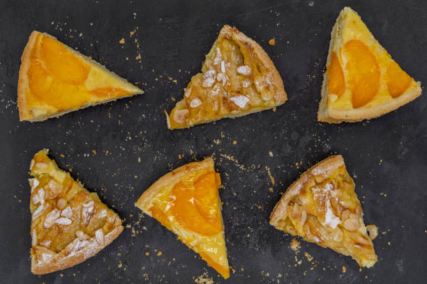 istock slices of assorted fruit tart on black slate 2185216237