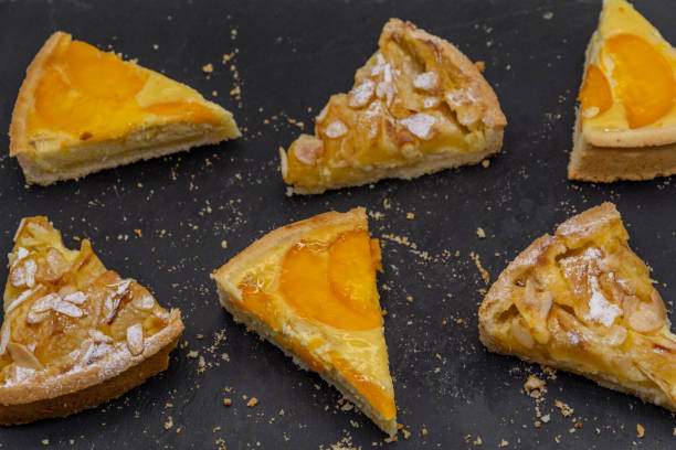 istock slices of assorted fruit tart on black slate 2185216247