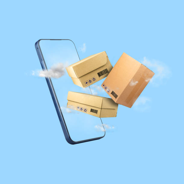 istock Delivery concept. Cardboard boxes and smartphone on a blue cloudy sky. Isolated. Background for companies transporting and delivering goods. Business 2185217122