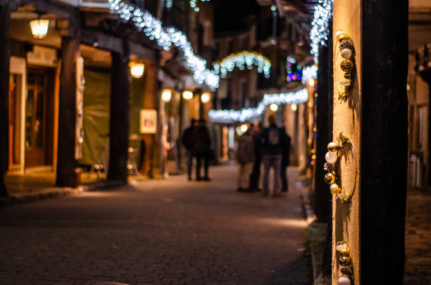 Walk at night with streets decorated with Christmas decorations and decorations and a multitude of lights, Medina de Rioseco, Valladolid, Castilla y Leon, Spain - December 8, 2023