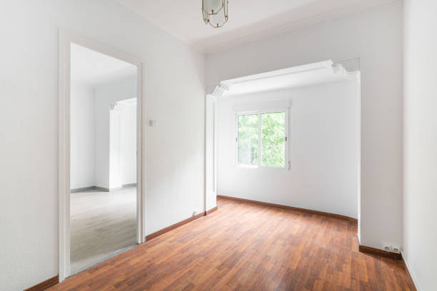 istock Bright, spacious empty white apartment with curly arch windows and luxury chandelier with wooden floors in dark and light shades. Concept of moving to new modern apartment 2185218019